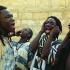 Les mains aux oreilles, quatre Baye Fall chantent. Touba, Sénégal, février 2008.